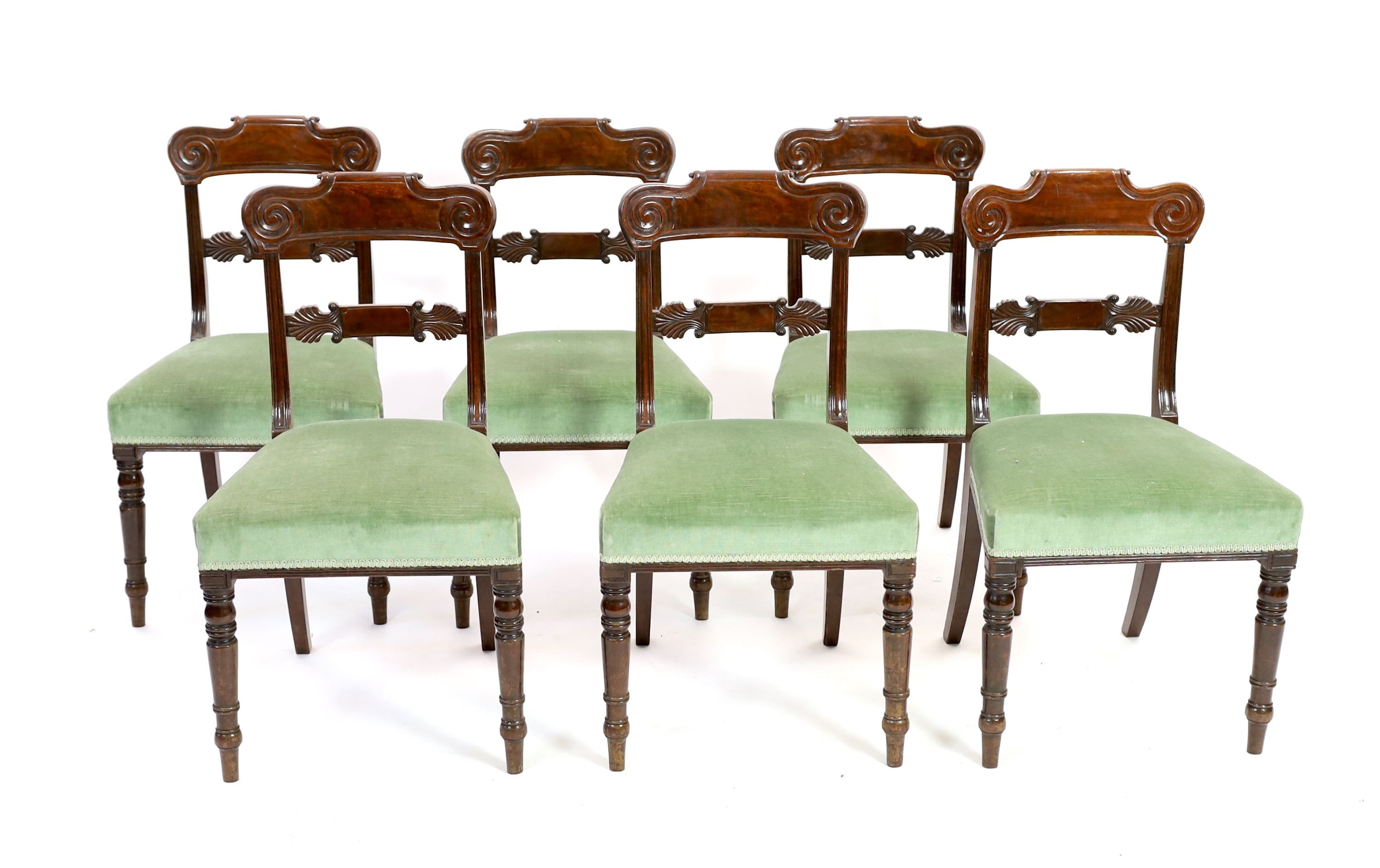 A set of six Regency mahogany dining chairs, with anthemion carved spars
